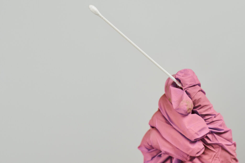 doctor-wearing-pink-gloves-for-the-hpv-test-after-pap-smear-test